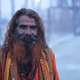 A holy man with henna-dyed beard has just had a dip in the Ganga on February 6.